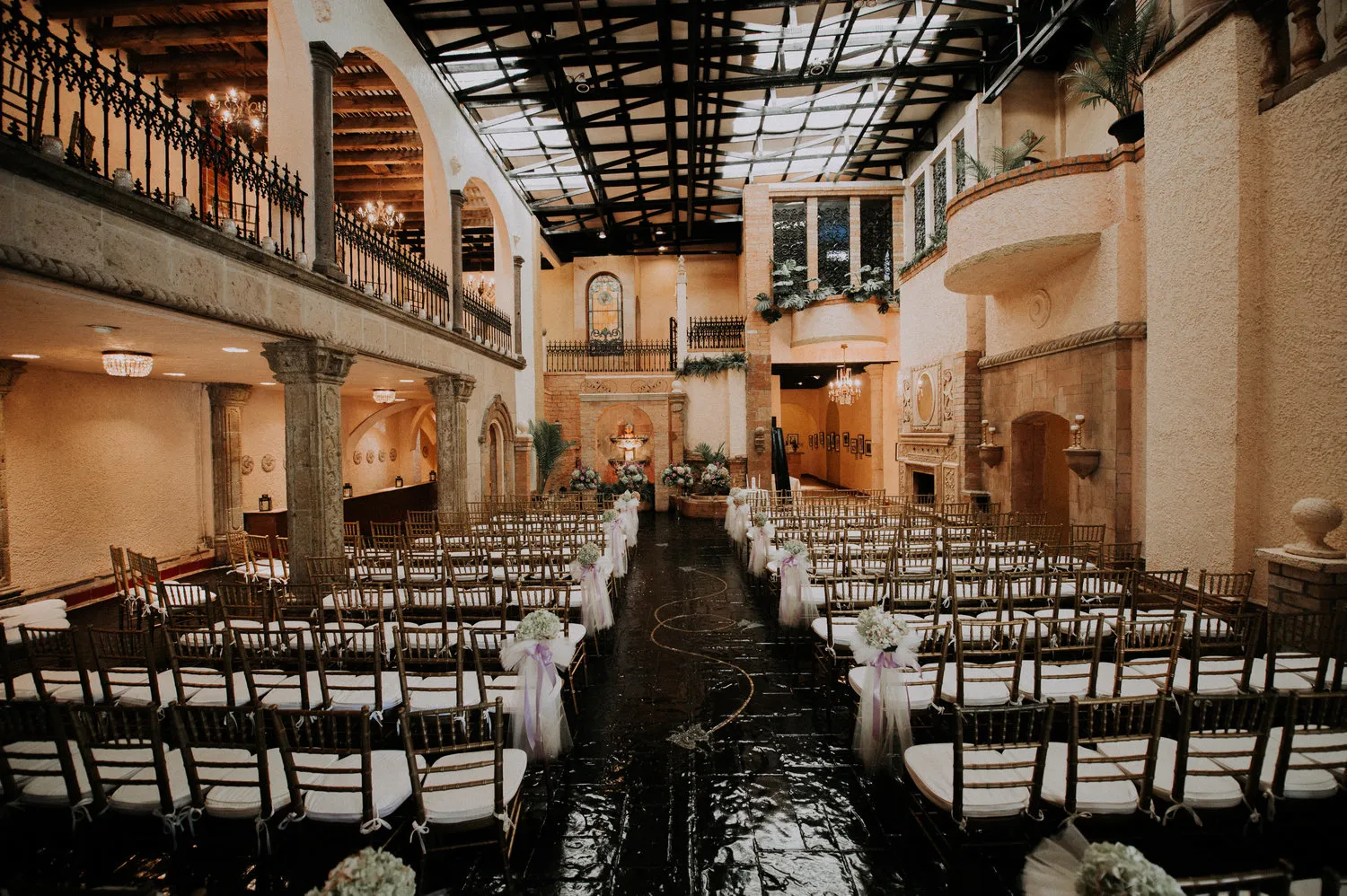 Rows of chairs set for a ceremony in the skylit hall