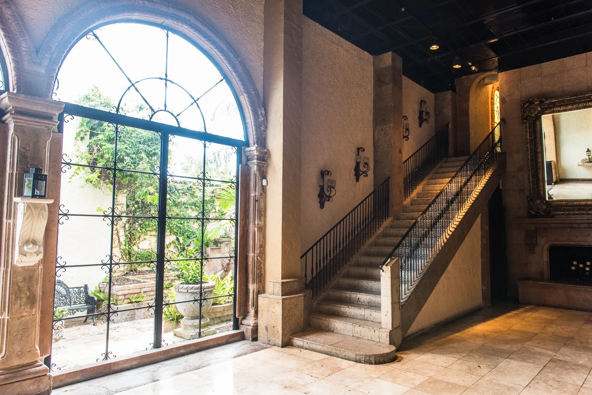 Arched window and staircase inside the venue